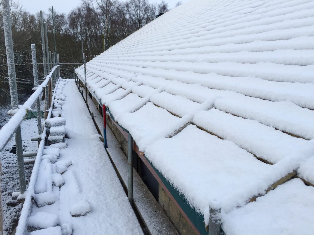 Roof Snow Removal: When to Do It and How